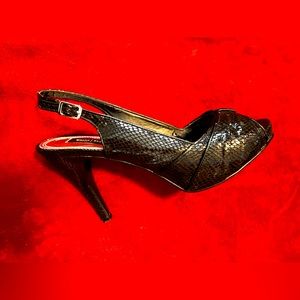 Beautiful Black snake skin heels from White House, Black market 8 1/2 M size.